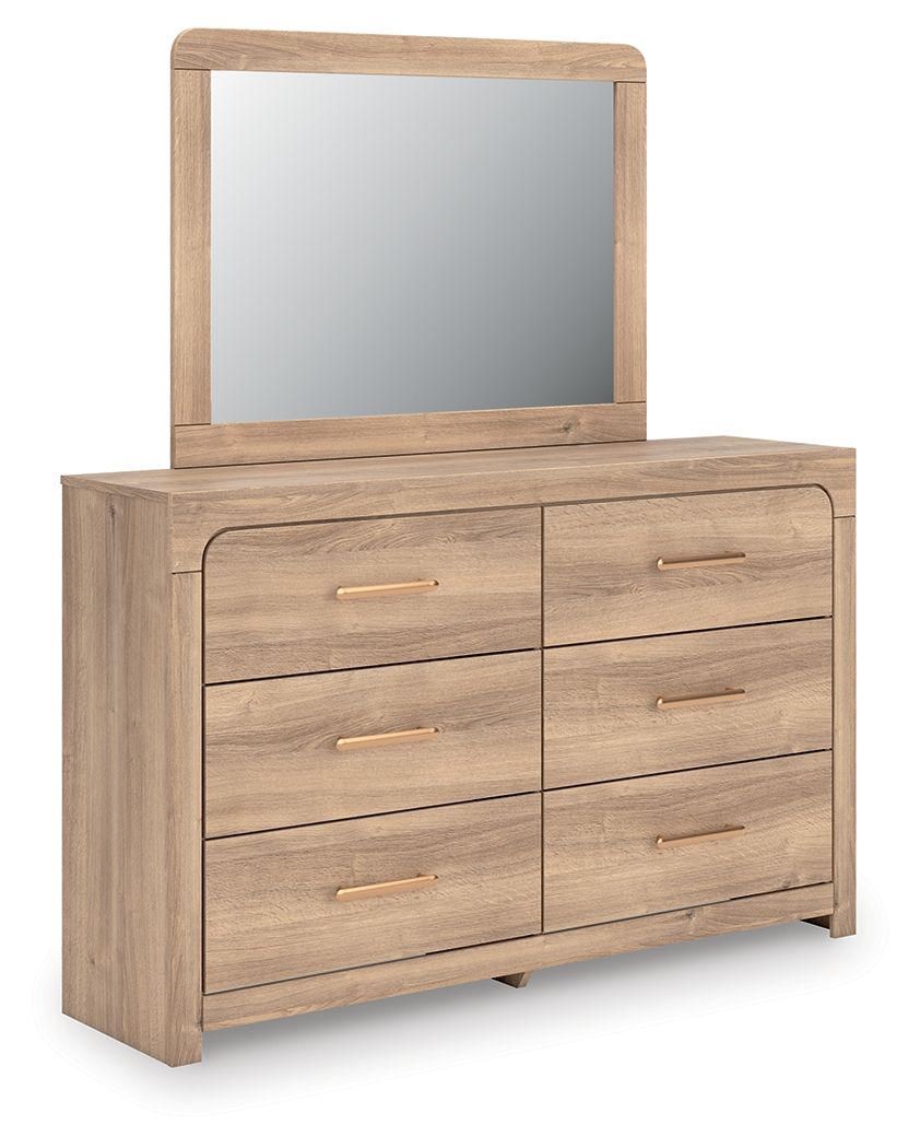 Tan dresser with arched mirror and six drawers, gold bar pulls