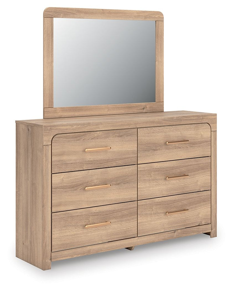 Tan dresser with arched mirror and six drawers, gold bar pulls