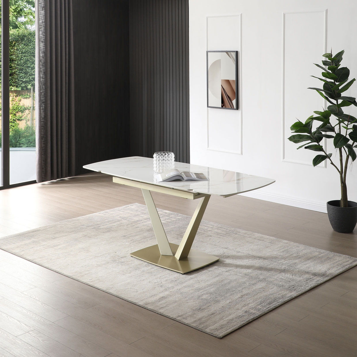Dining table with glossy white marble-look top and gold pedestal base, floor view