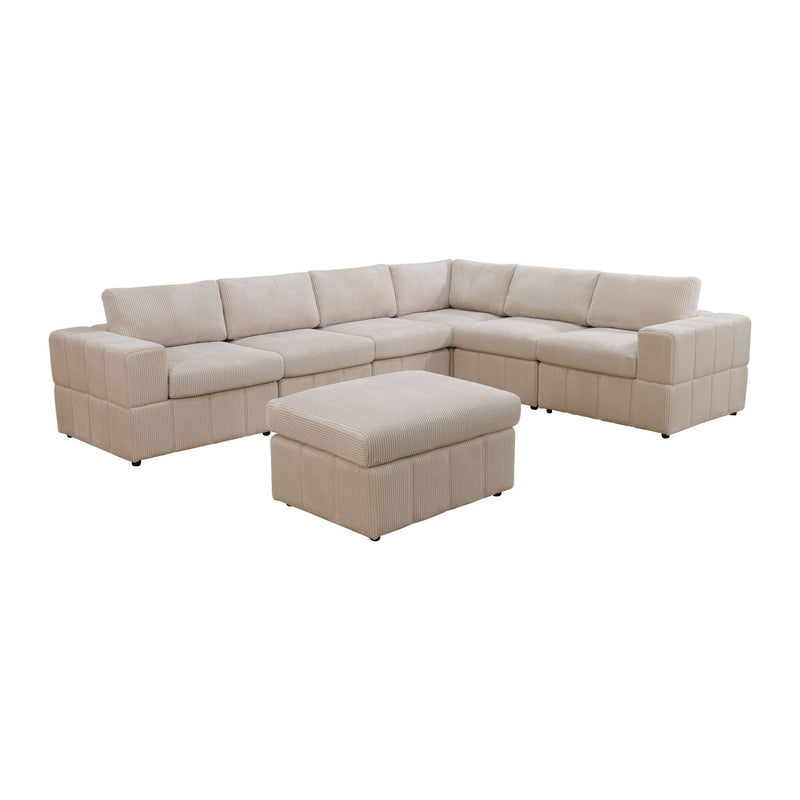 Beige modular sectional sofa with matching ottoman and plush block-style upholstery.