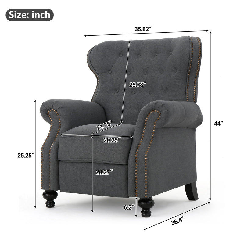 Dark gray tufted recliner chair with studded trim and curved armrests.