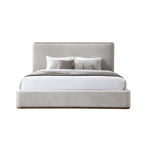Light gray upholstered bed with white sheet and pillows, slatted base