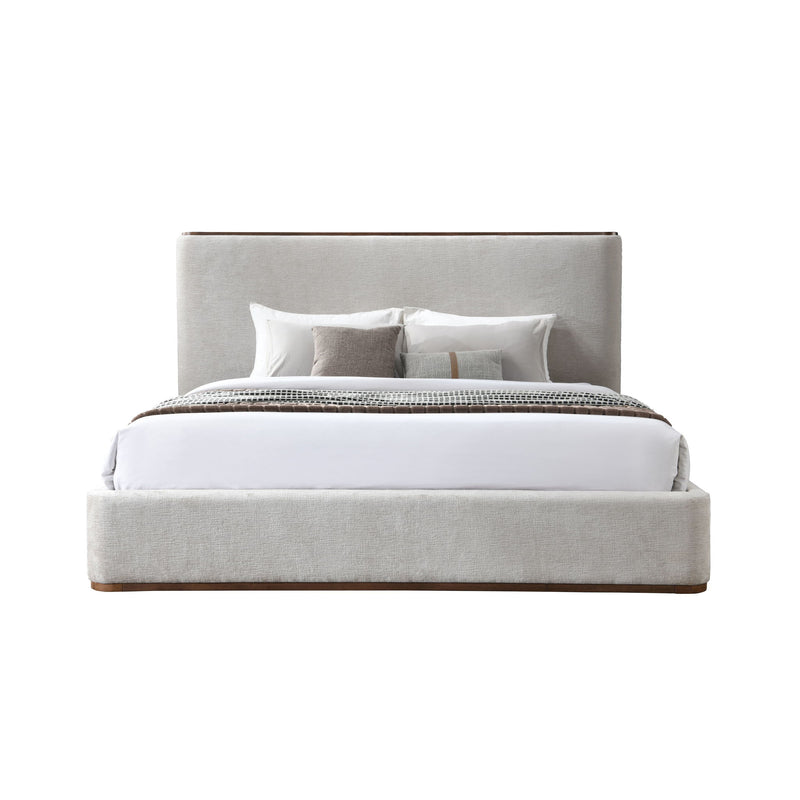 Light gray upholstered bed with white sheet and pillows, slatted base