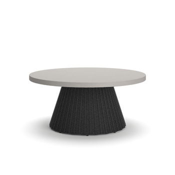 Baymont Cove round coffee table with gray top and wide woven base