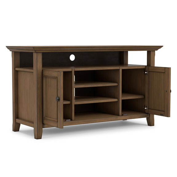 Aged brown TV media stand with open shelving and side cabinet doors, front view