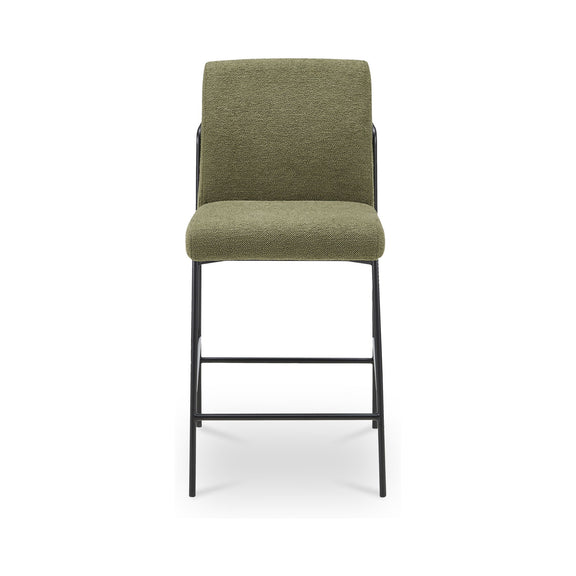 Green upholstered counter stool with tall back, dark metal frame and bar footrest