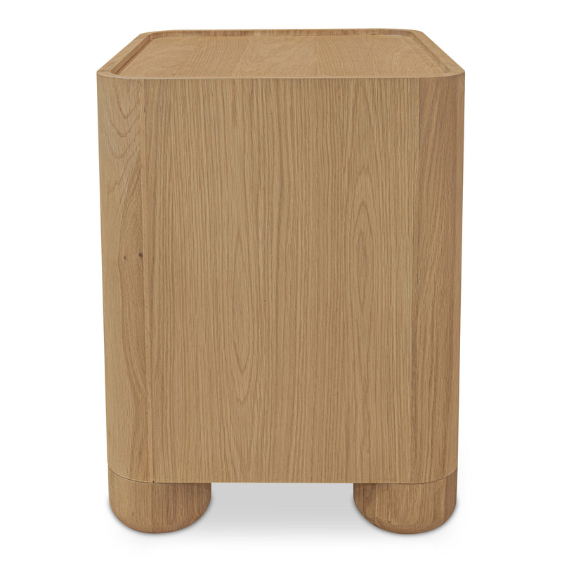 Light brown wood nightstand shown from the side, with a raised-edge top and rounded feet.