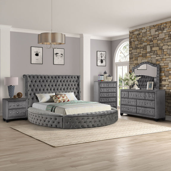 Black tufted storage bed with slat base, nightstands, chest drawers, and mirrored dresser