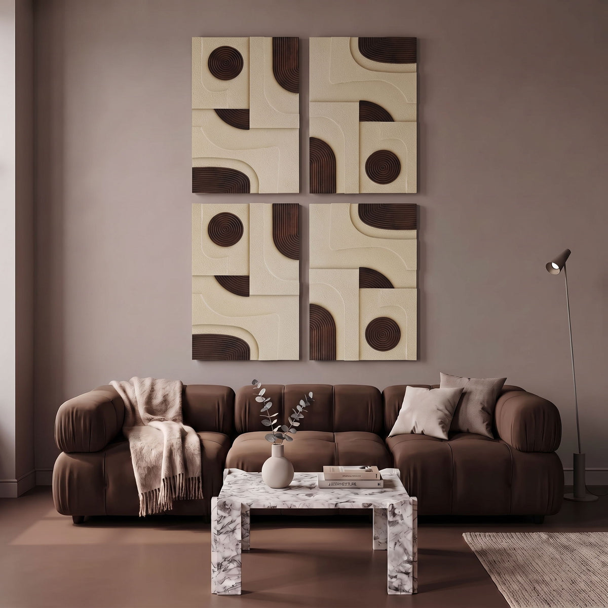 4-piece wall art with black concentric circles and arc details on cream blocks above sofa