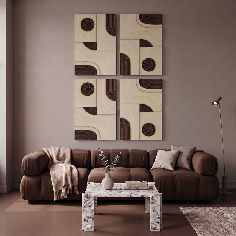 4-piece wall art with black concentric circles and arc details on cream blocks above sofa