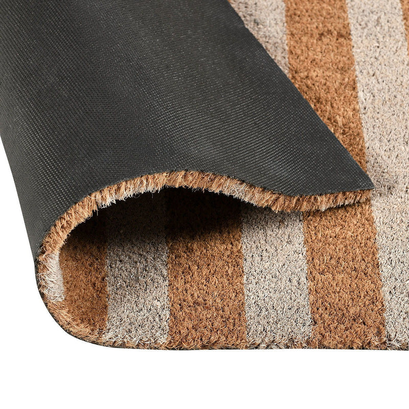 Rolled doormat edge with dark backing and tan, beige, and brown stripes.