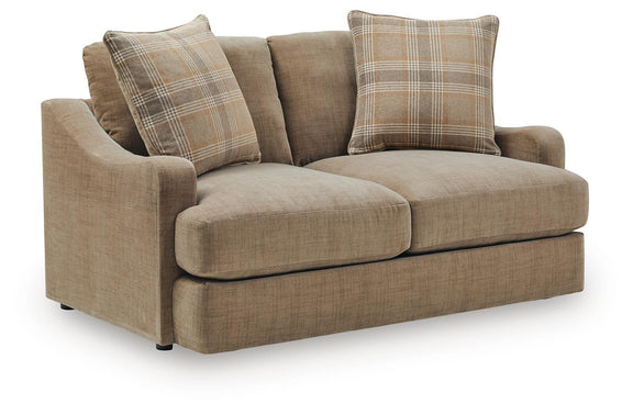 Beige upholstered loveseat with plaid throw pillows and two plain back cushions