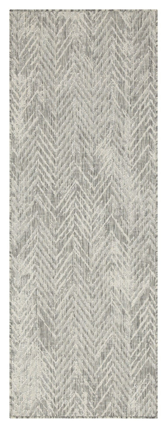 Indoor/outdoor area rug with light gray and cream chevron pattern, flatwoven look.