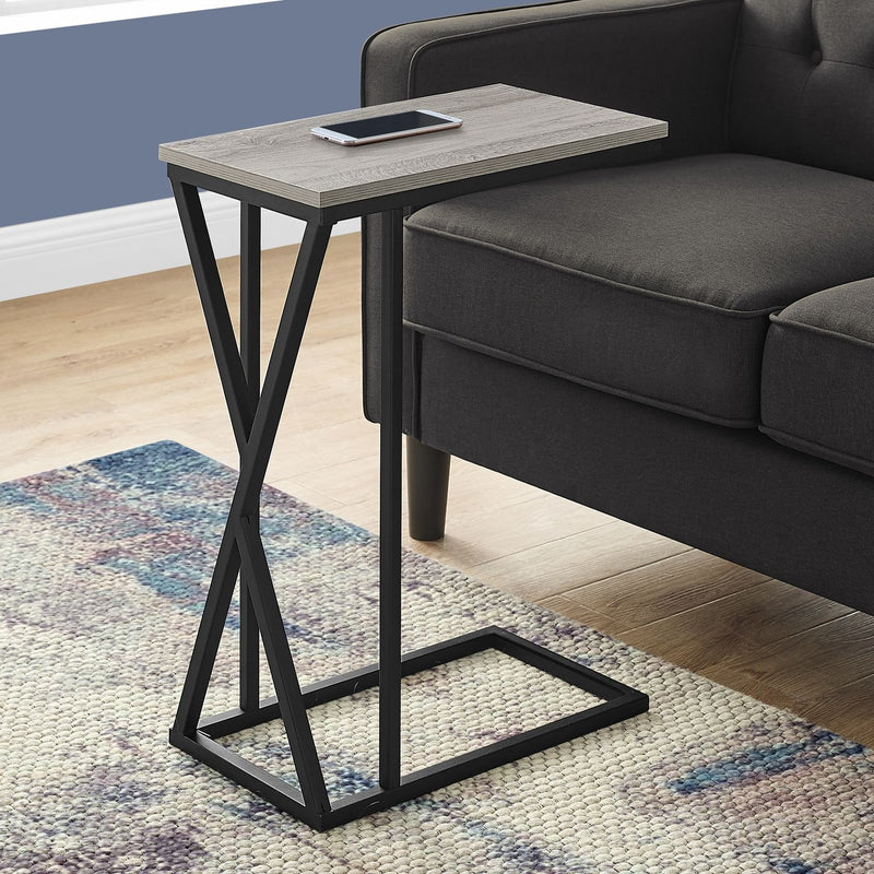 Modern accent table with black frame and light gray tabletop with lower open shelf.