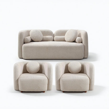 Beige upholstered sofa and two armchairs with round accent cushions
