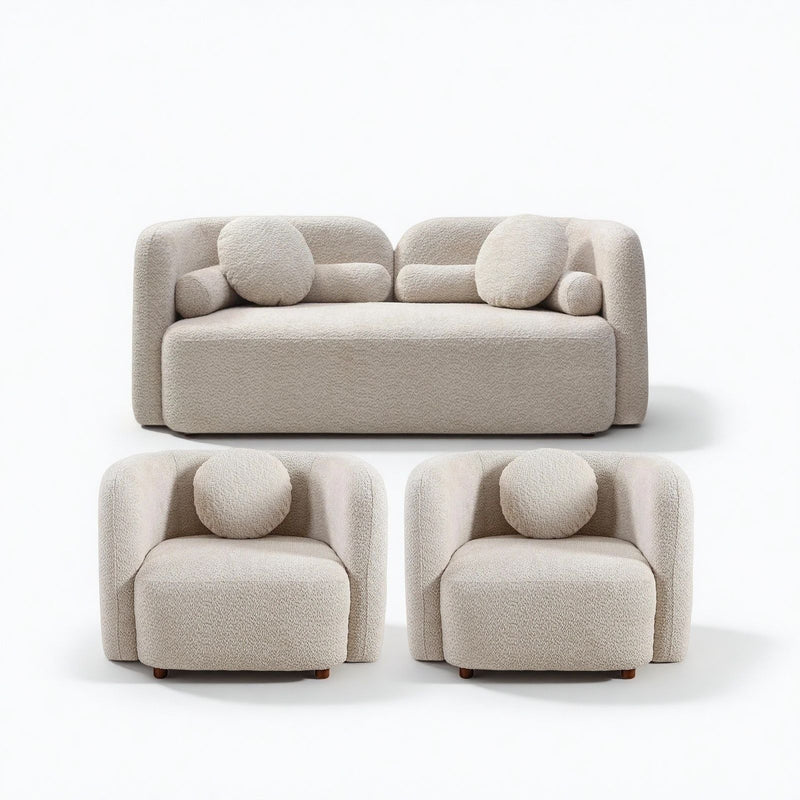 Beige upholstered sofa and two armchairs with round accent cushions