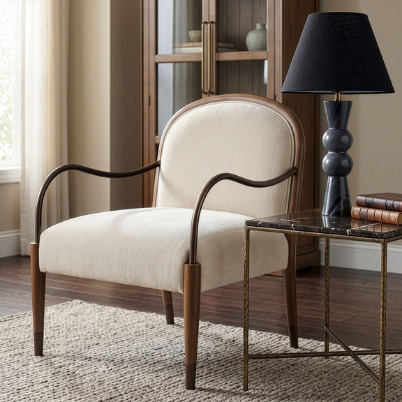 Beige fabric-upholstered accent chair with curved metal arms and square cushion