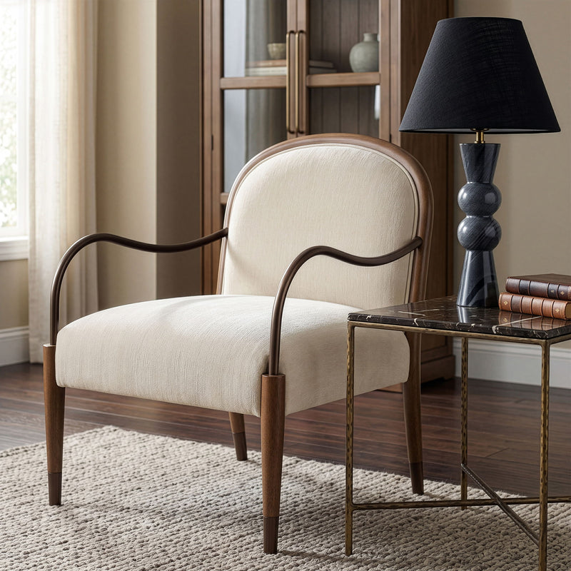 Beige fabric-upholstered accent chair with curved metal arms and square cushion