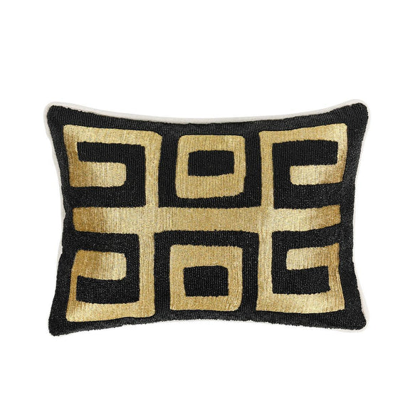 Black rectangular throw pillow with gold geometric Greek-key pattern