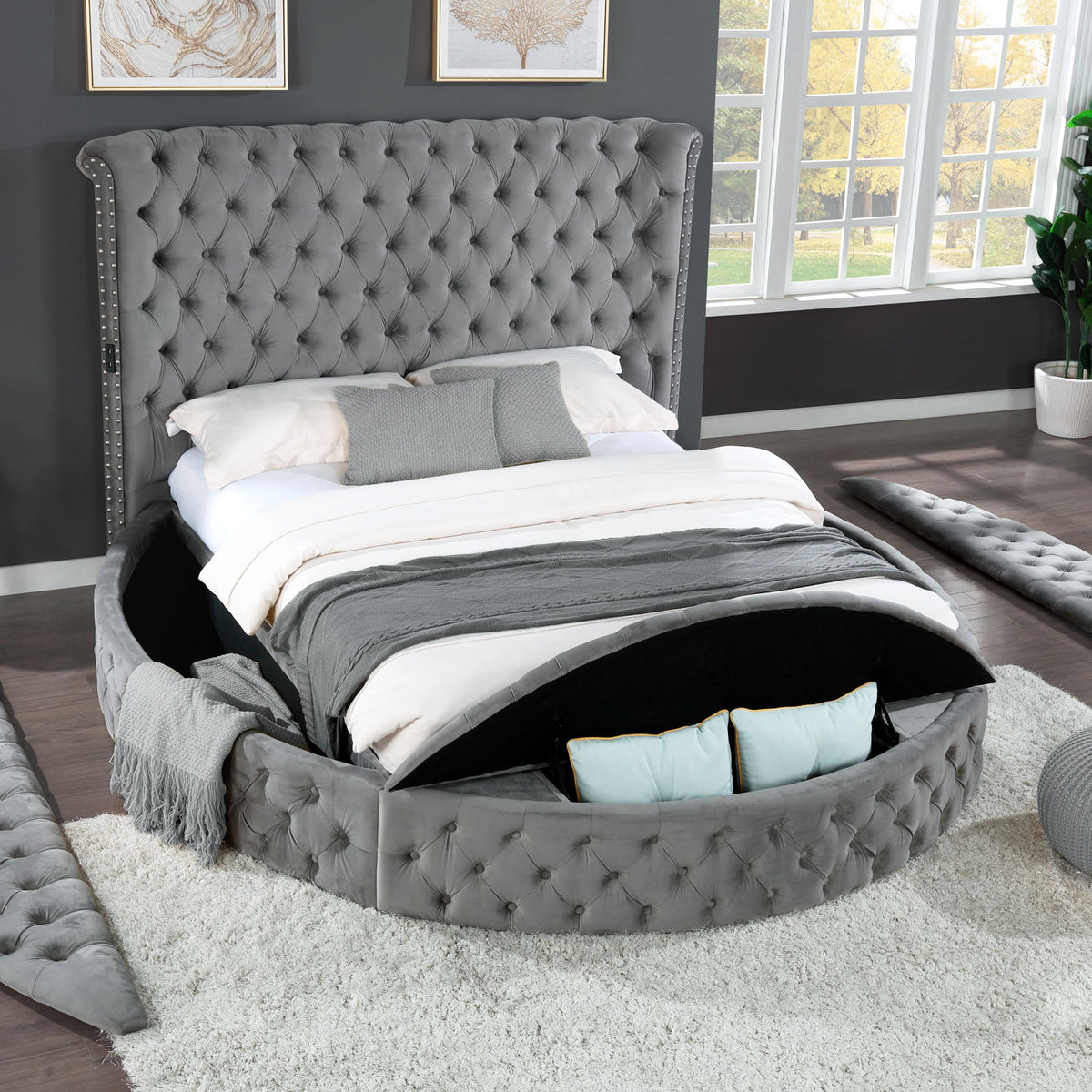 Gray tufted king bed with upholstered frame and storage drawer base