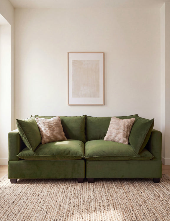Olive green sectional sofa with two seat cushions and decorative pillows