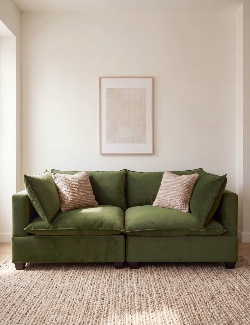 Olive green sectional sofa with two seat cushions and decorative pillows