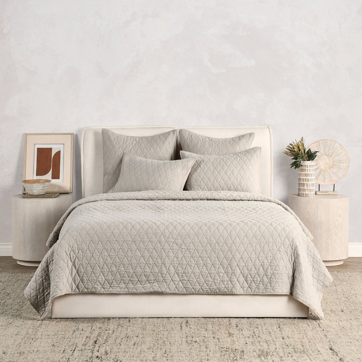 Natural-toned quilt set with diamond quilting and four matching pillows