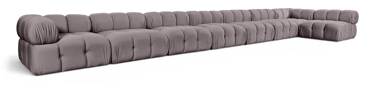 L-shaped velvet sectional sofa in dark gray with tufted seat cushions and rolled arms