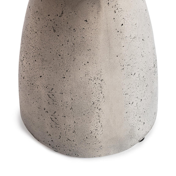 Outdoor accent table, light gray speckled concrete pedestal body close-up