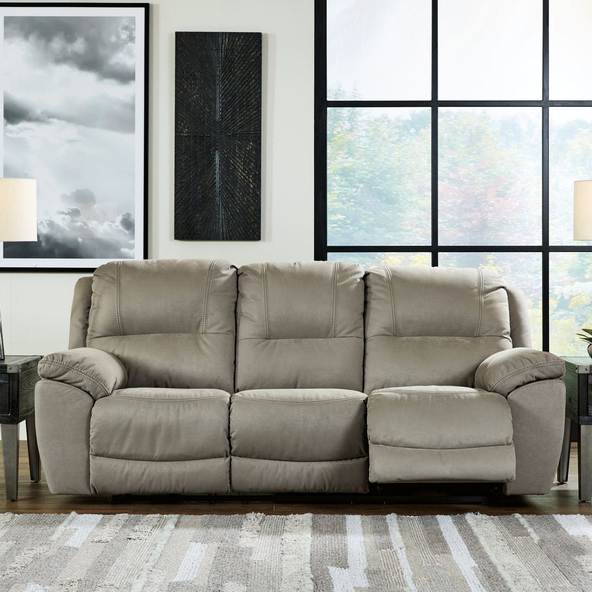 Putty reclining loveseat with tufted back, wide armrests, and drop-down footrest