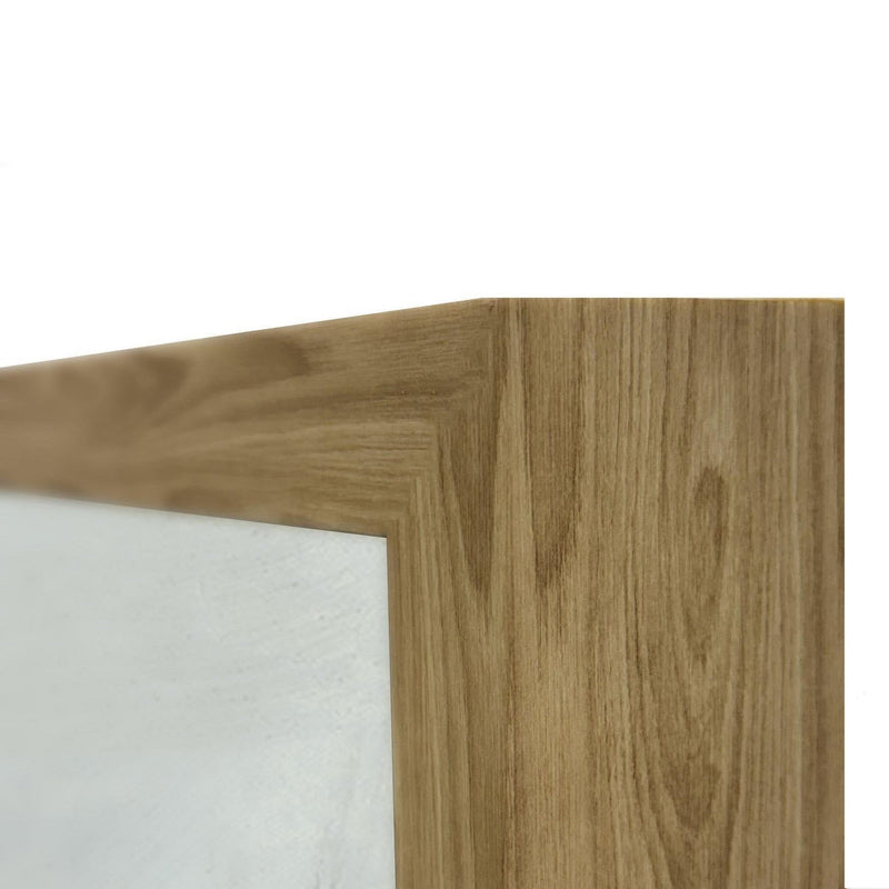 Wood frame edge and corner detail with white matte border on abstract painting