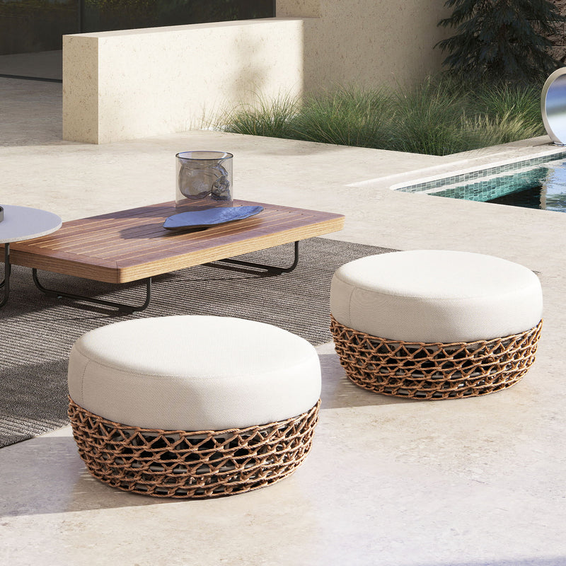 Round light beige patio ottoman, upholstered seat on dark woven wicker base
