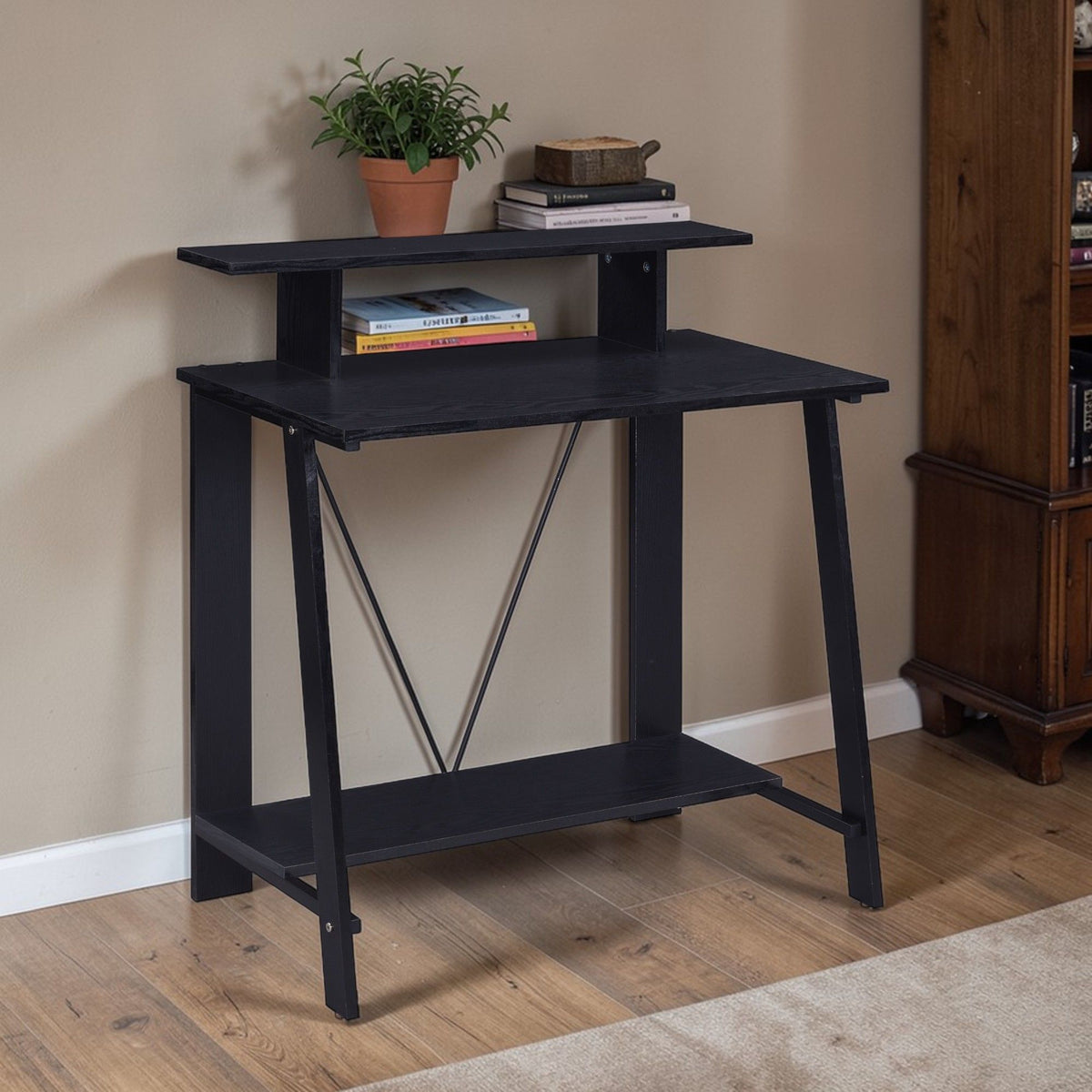 Modern writing desk with dark finish, open lower shelf, and X-brace frame