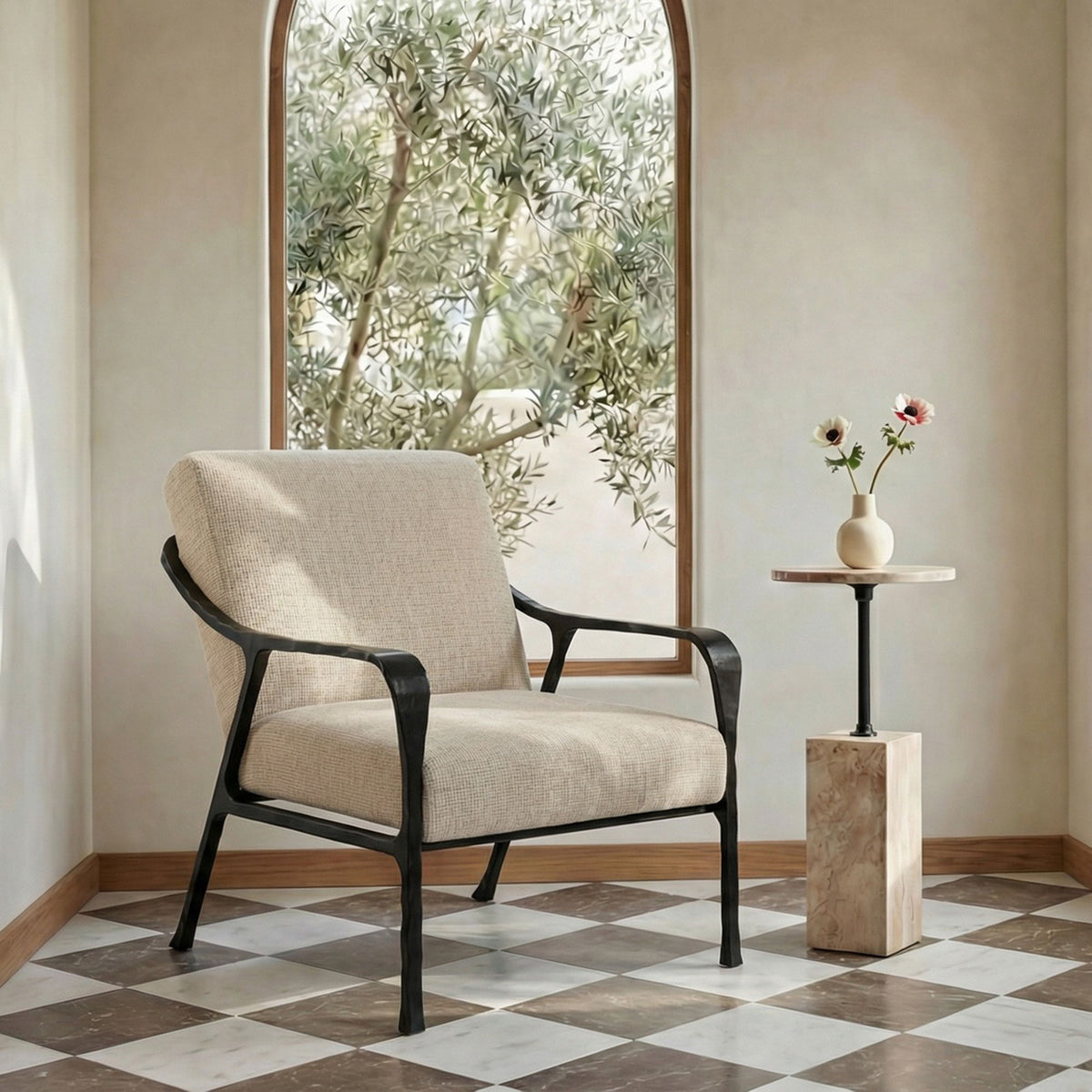 Beige fabric accent chair with black armrests and legs, padded seat and backrest.