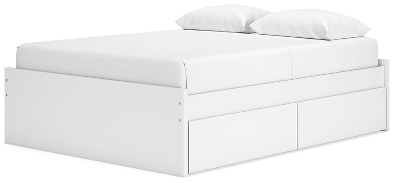 White platform bed with a side storage drawer panel