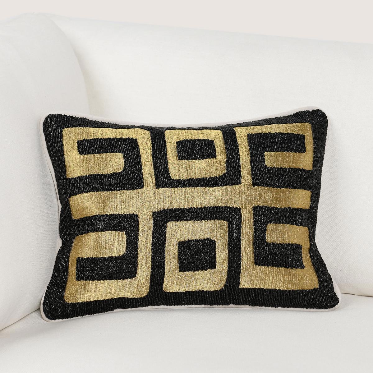 Black rectangular throw pillow with gold geometric Greek-key pattern, angled
