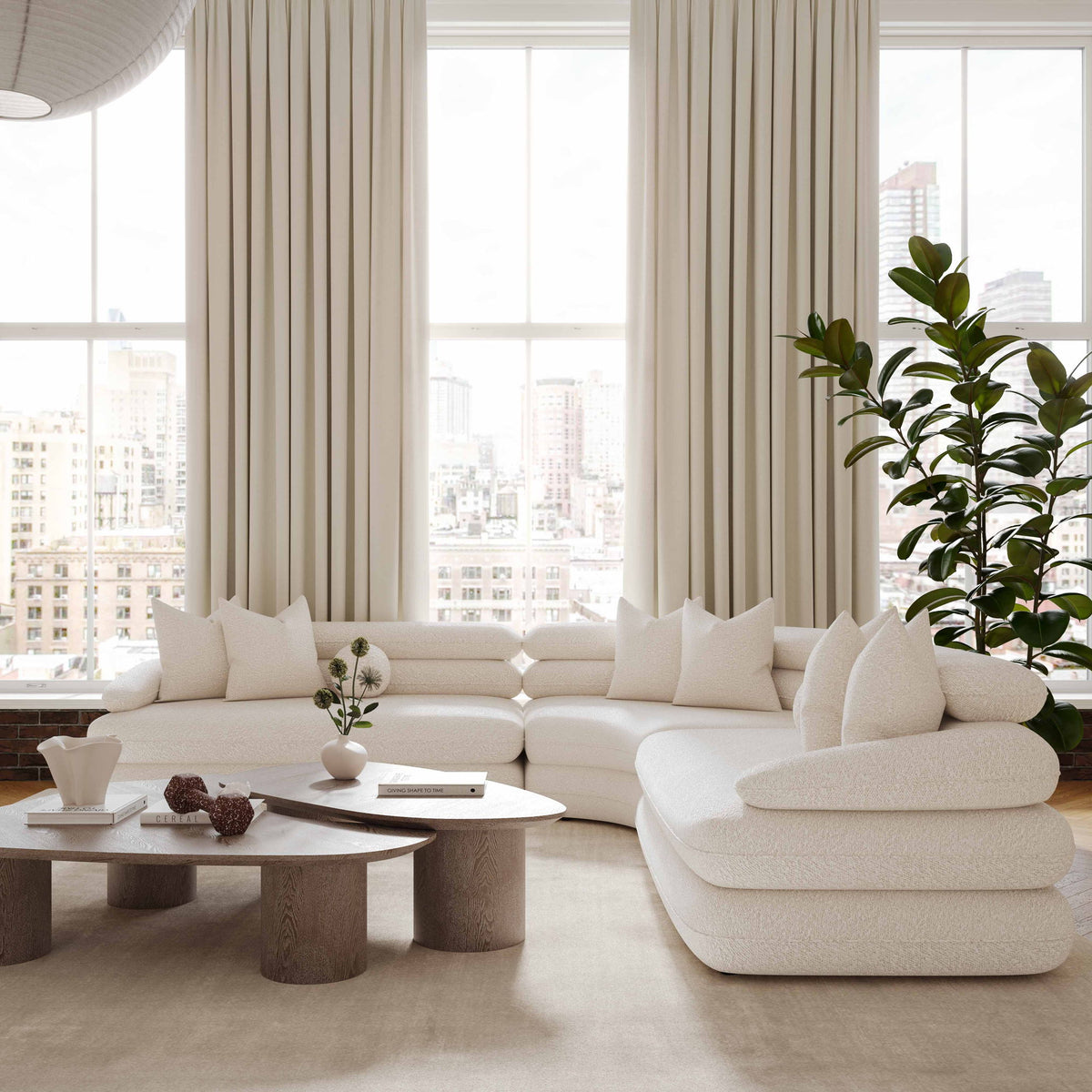 Washed ash oblong coffee table with rounded tabletop, shown in front of a sofa