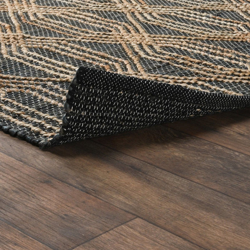 Blue and charcoal rug corner detail with textured edge and woven lattice pattern
