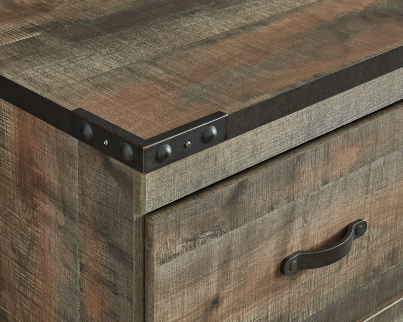 Brown wood TV stand drawer with metal knob and corner bracket detail