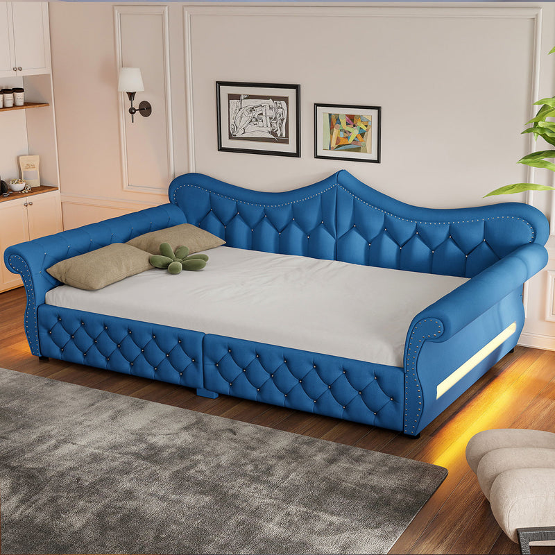 Blue upholstered daybed with tufted panels and side LED strip, curved nailhead trim