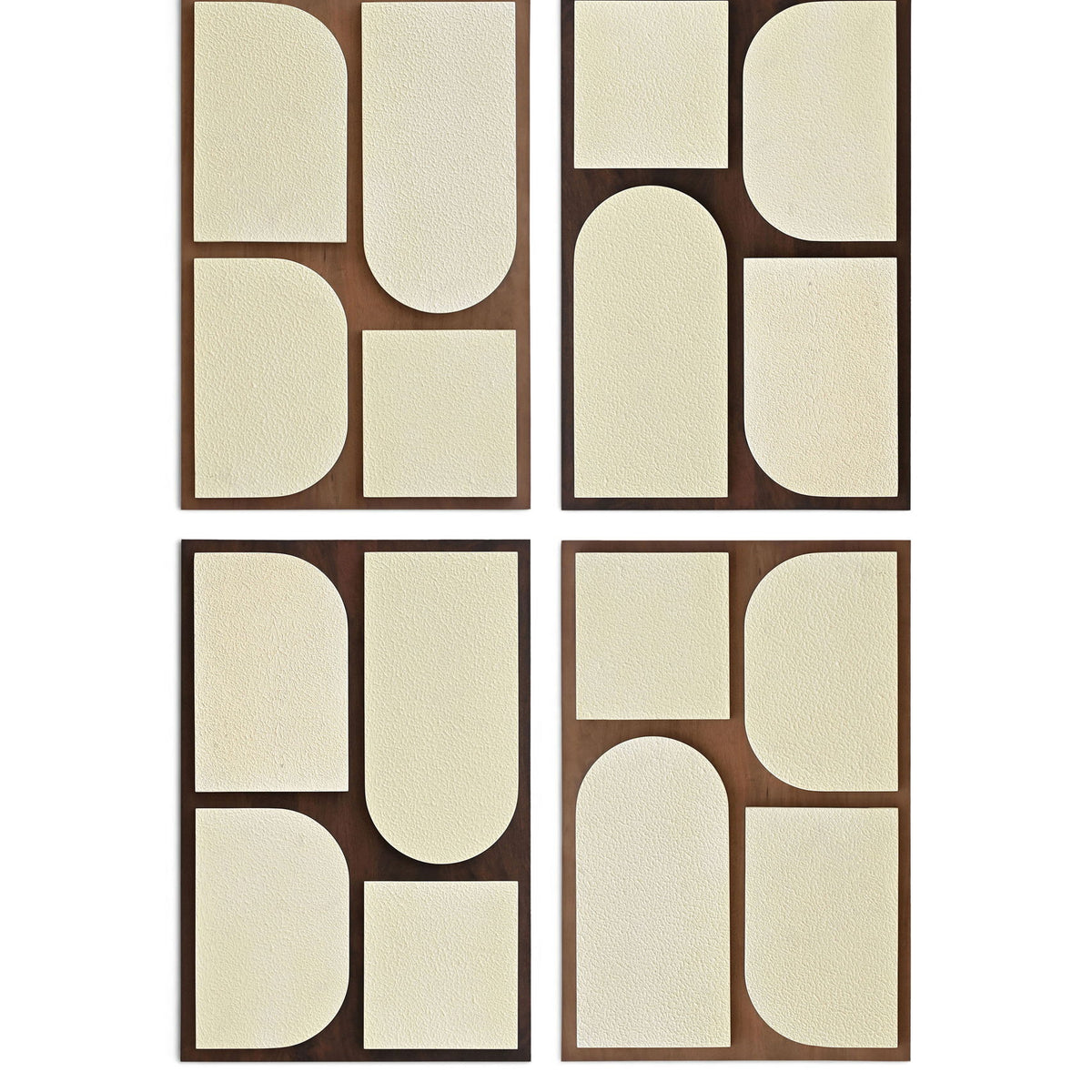 Four-piece wall art set with brown frames and off-white geometric cutout shapes