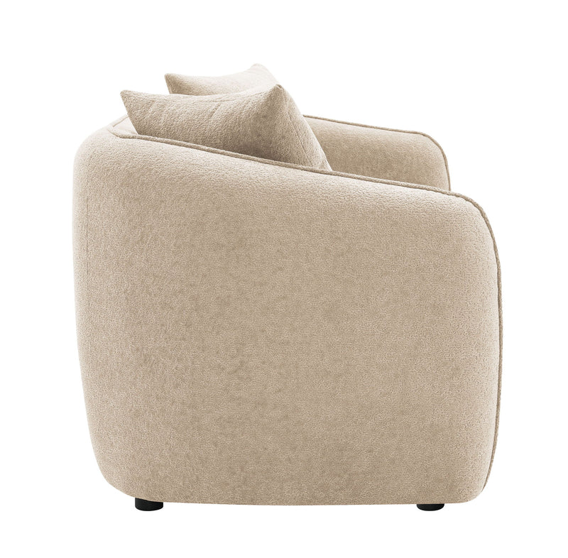 Beige upholstered armchair with rounded arms and a matching toss pillow