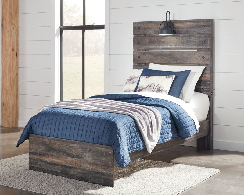 Drystan panel bed with dark wood frame and slatted headboard, styled with bedding
