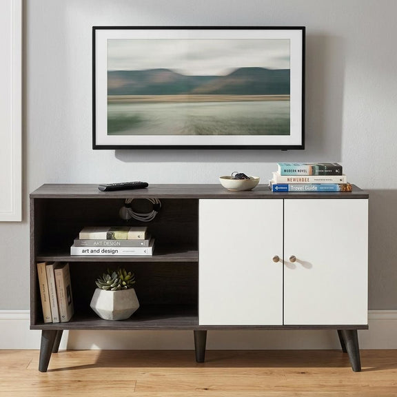 Dark brown TV stand with two open shelves and cabinet with two white doors