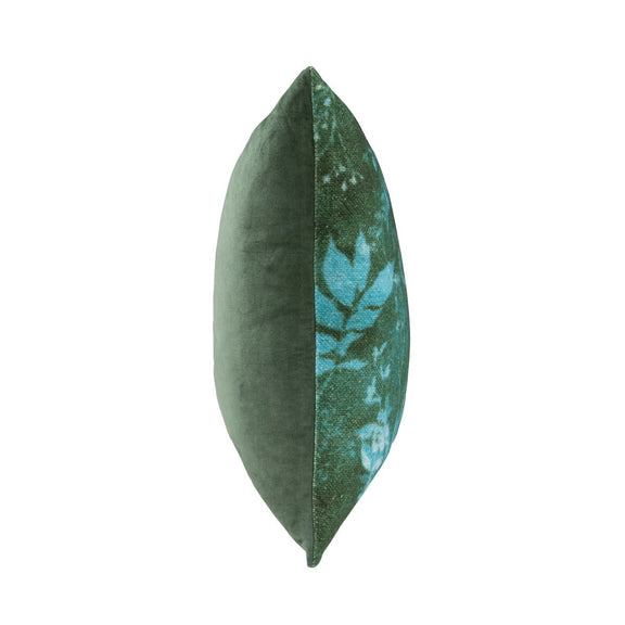 Green square throw pillow side view with blue leaf pattern panel