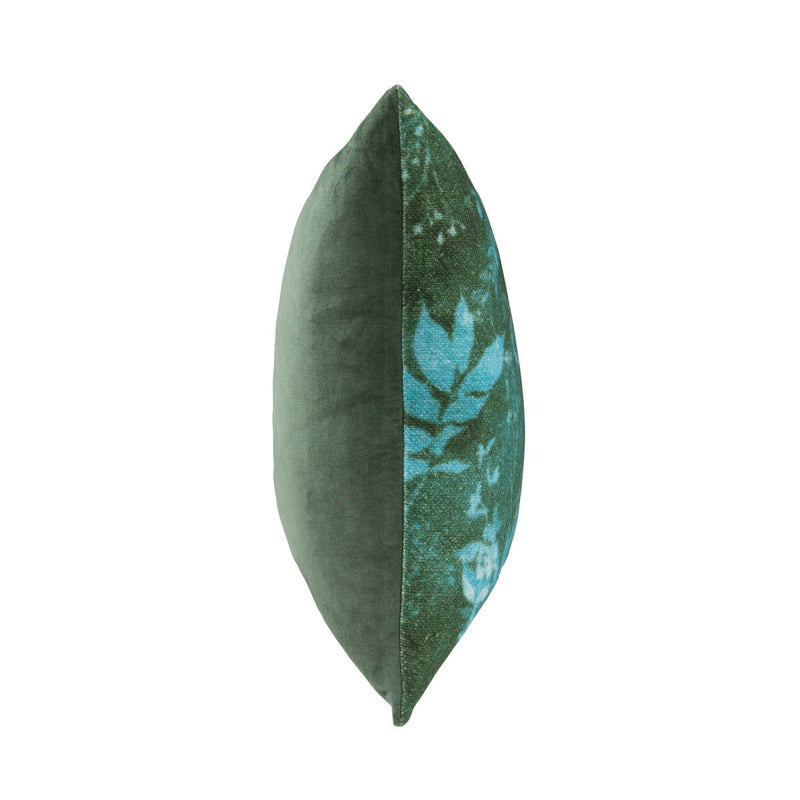 Green square throw pillow side view with blue leaf pattern panel