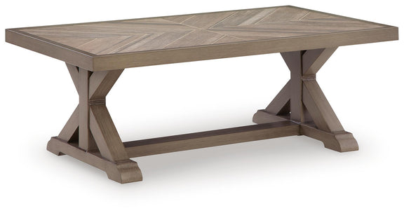 Rectangular beige cocktail table with angled legs and raised edge tabletop