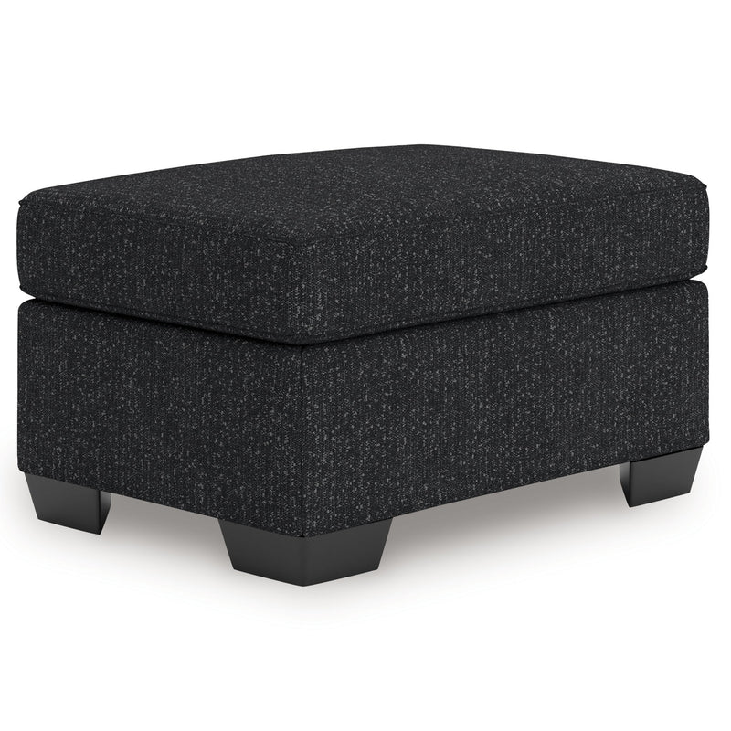 Charcoal upholstered ottoman with black legs and thick padded top