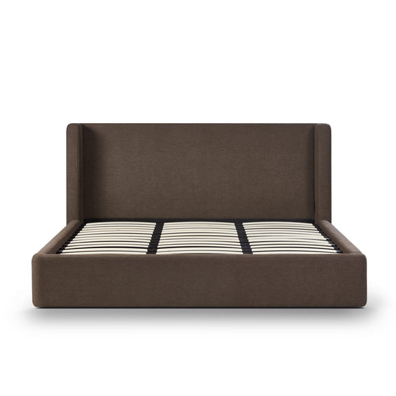 Dark brown upholstered bed frame with slatted mattress and black-and-white striped cover