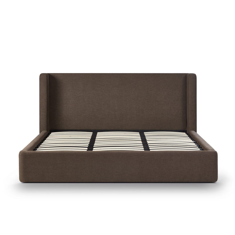 Dark brown upholstered bed frame with slatted mattress and black-and-white striped cover
